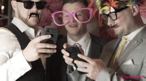 wedding guests viewing their photo booth images on their phone