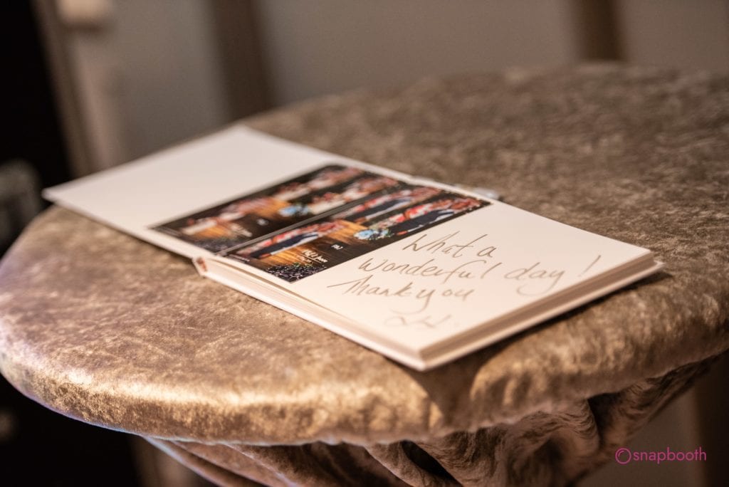 photo booth guest book on a table