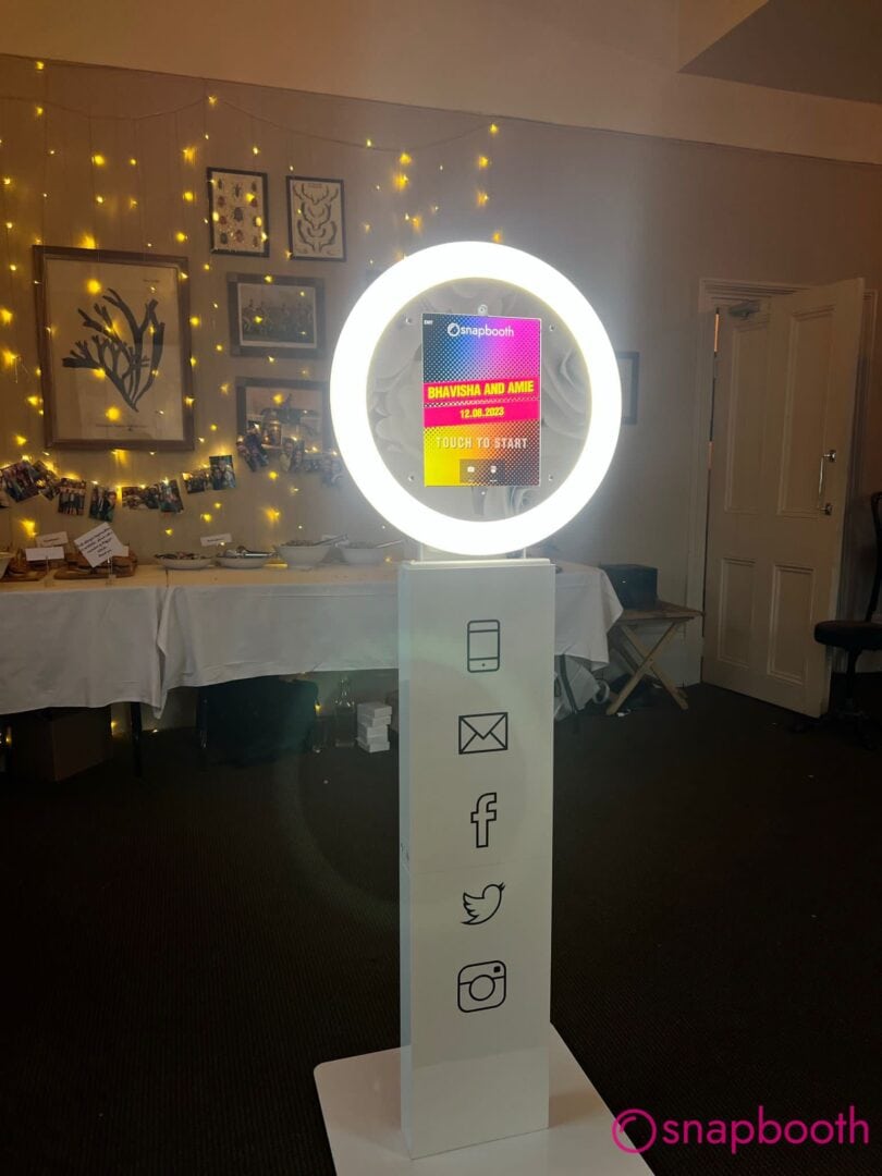 Wedding guests enjoying photo booth at a Thame celebration