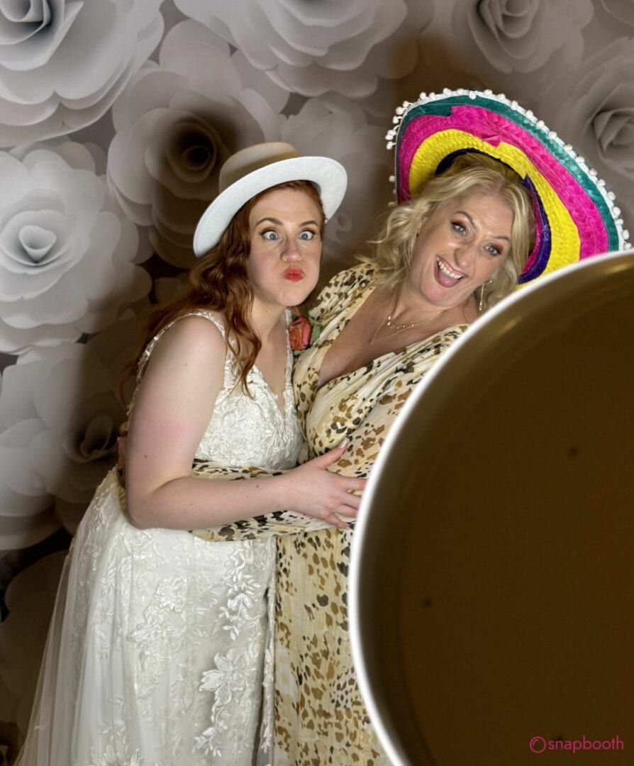 mother in law and bride being goofy with selfie pod photo booth