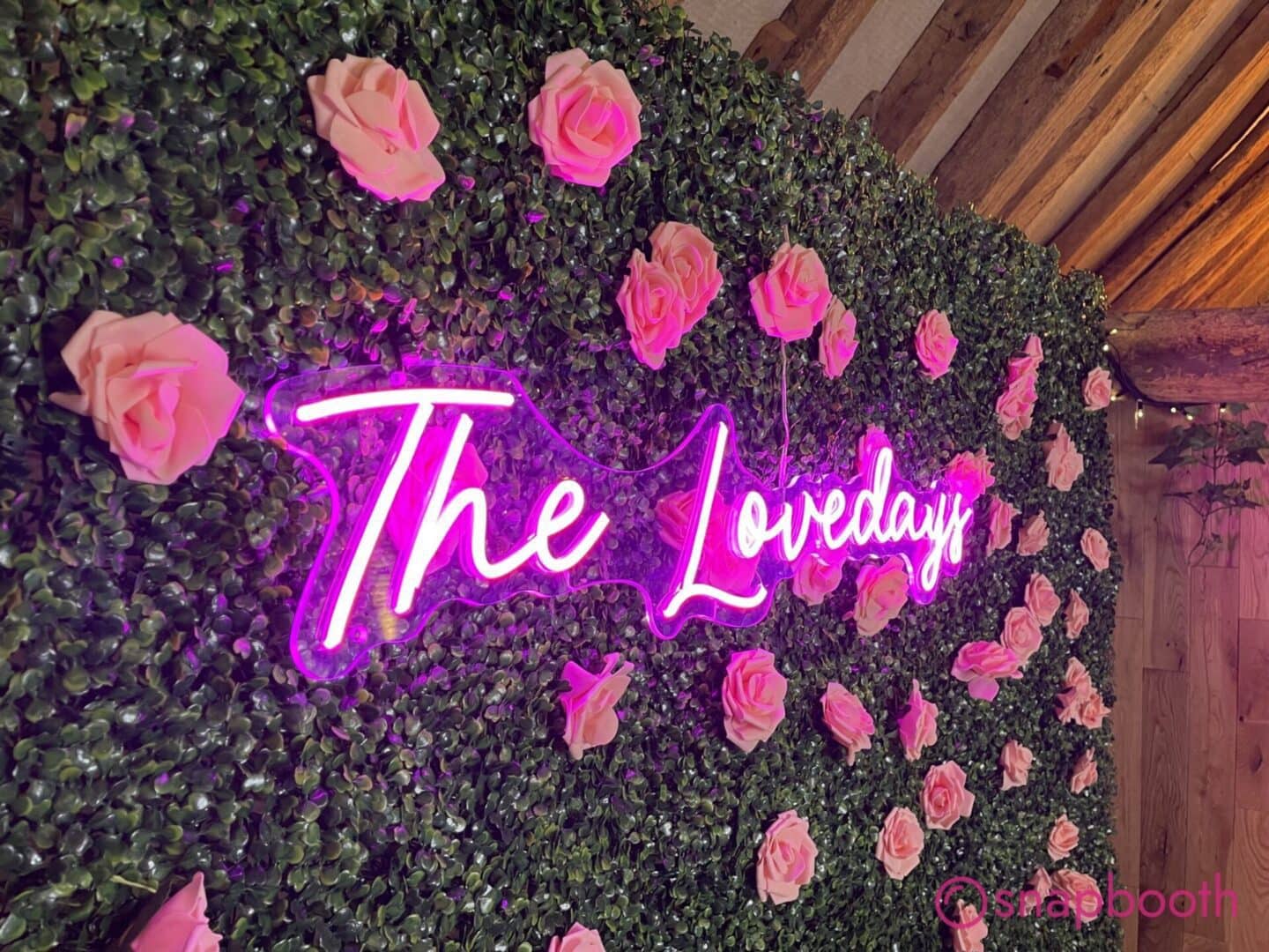 Photo booth with neon sign at a Haddenham event