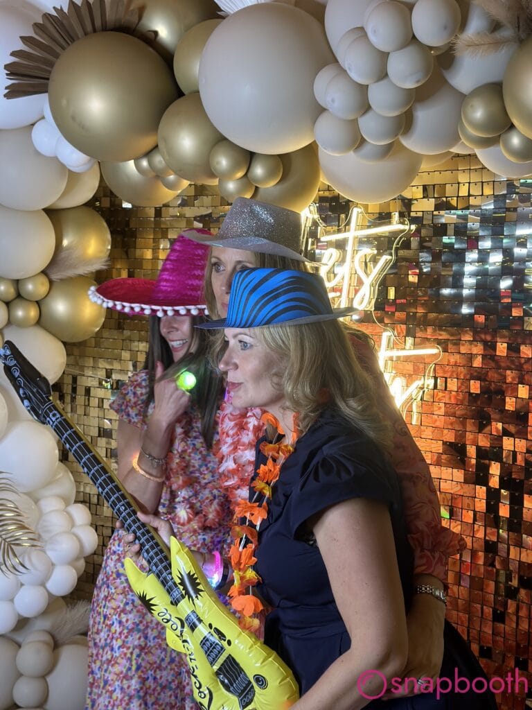 three ladies using the selfie pod wedding photo booth