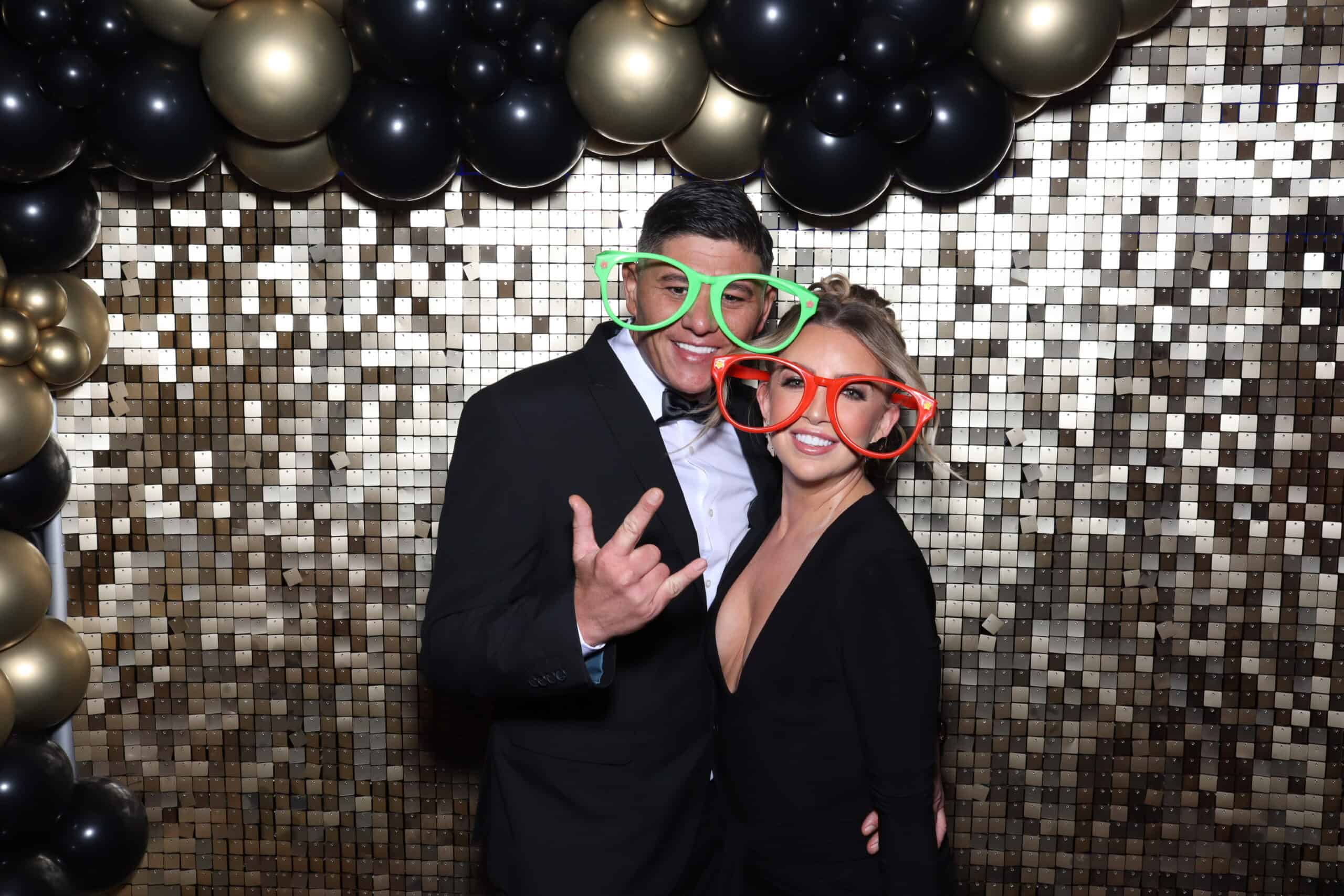 Guests posing at photo booth