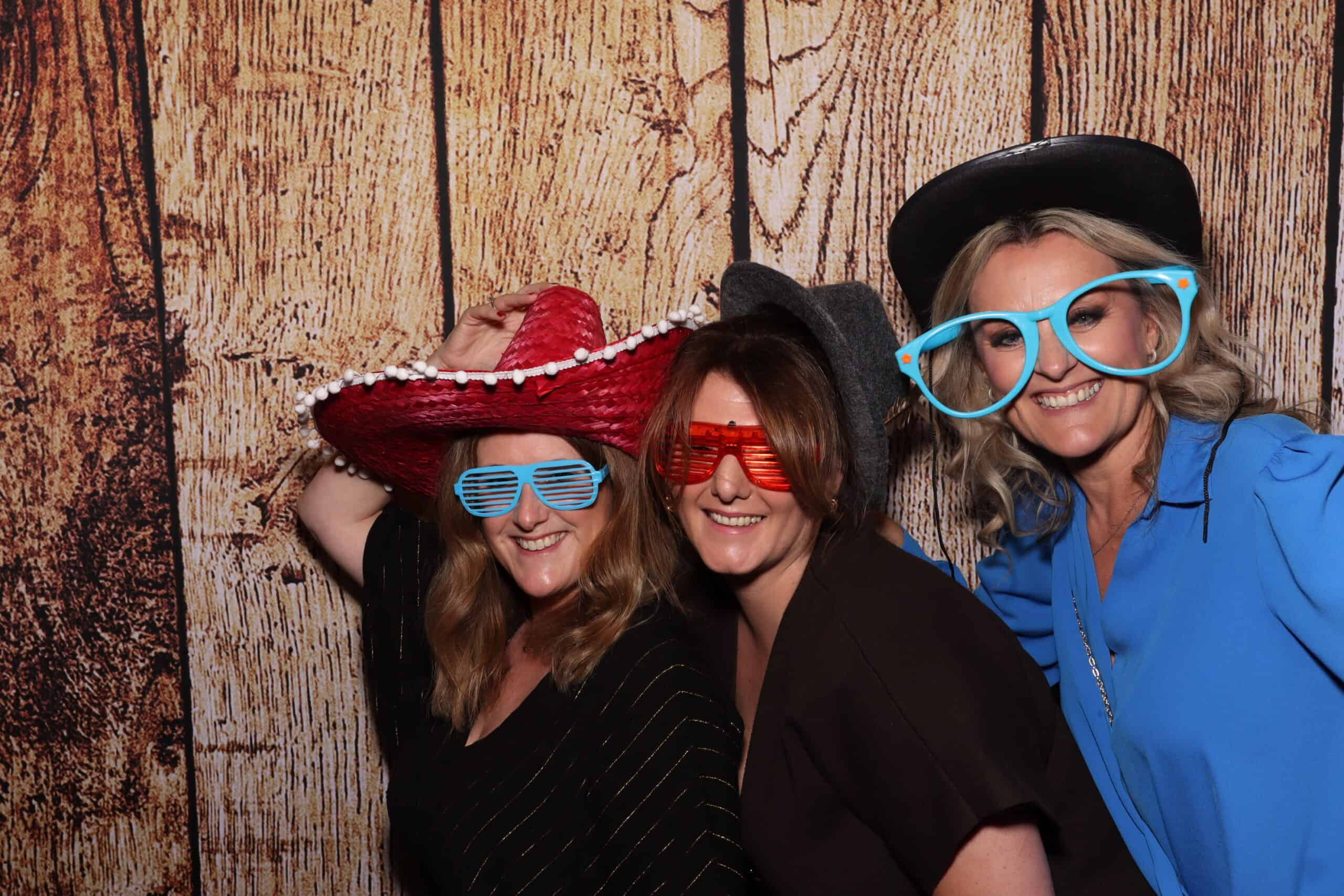 Birthday party photo booth hire - women wearing sombrero and novelty glasses
