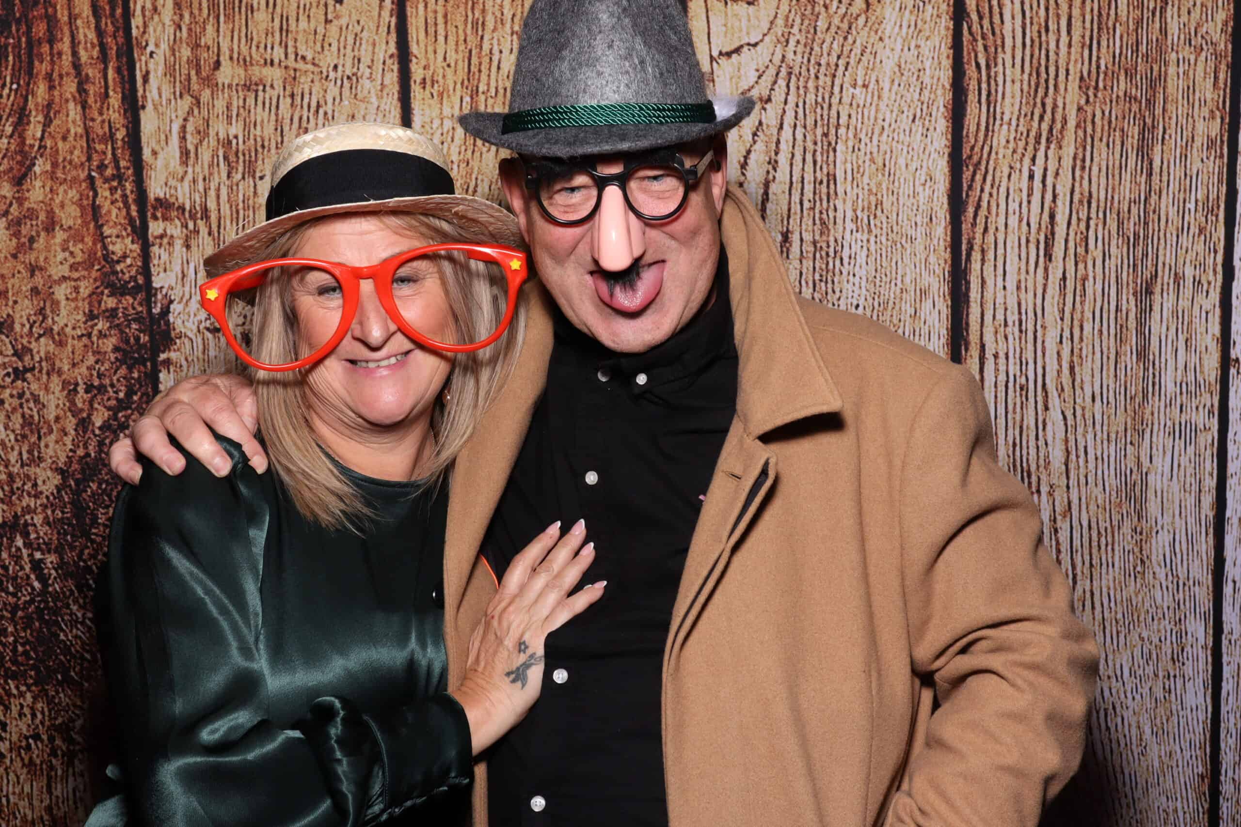 Photo booth hire - couple posing with props at Snap Booth event